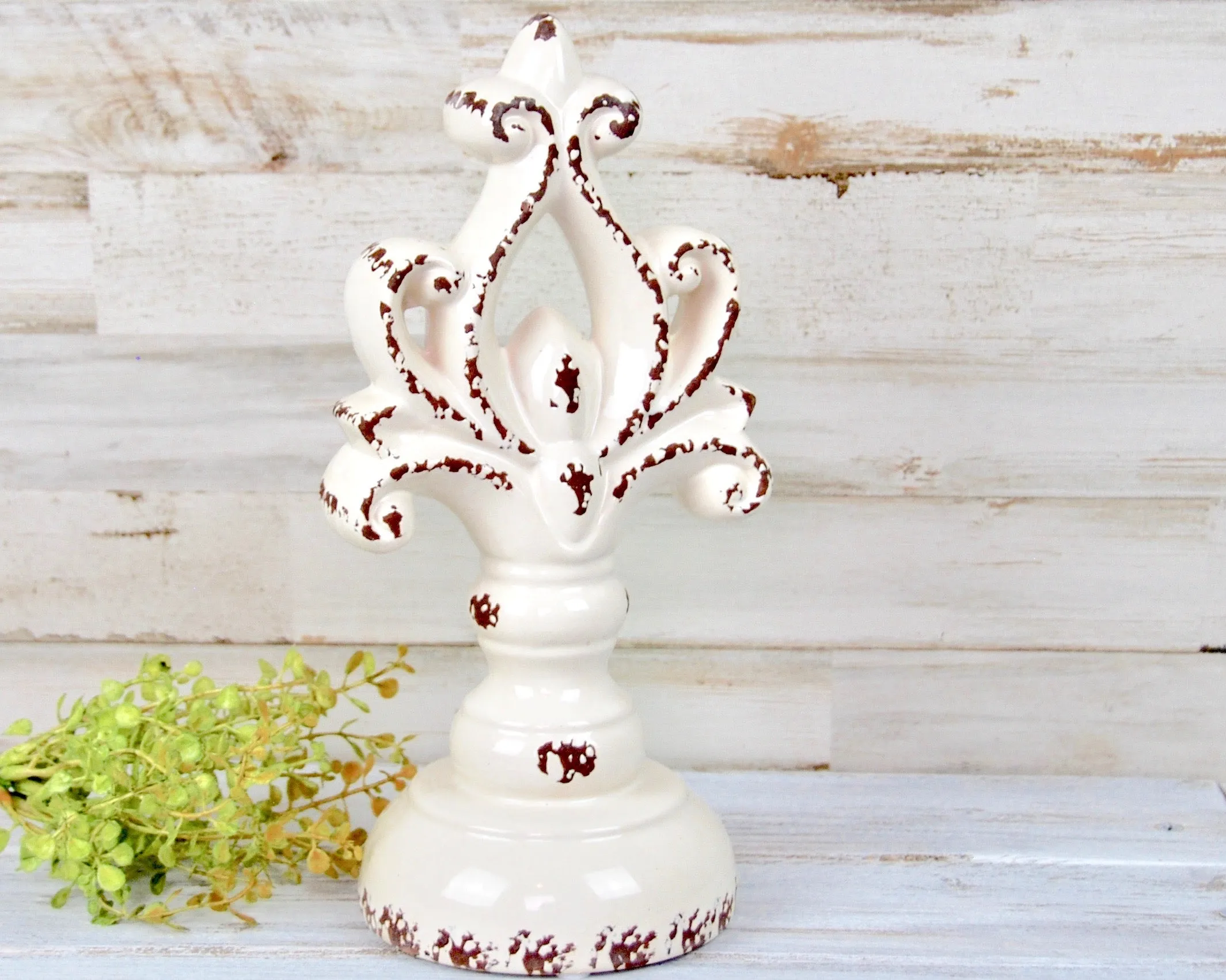 Worn white decorative ceramic finial pedestal